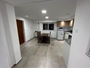 Η κουζίνα ή μικρή κουζίνα στο Departamentos Agringof 2 +4 φωτογραφίες