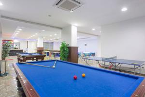 a pool table in a room with two tables at Club Sun Paradise Hotel - All Inclusive in Avsallar