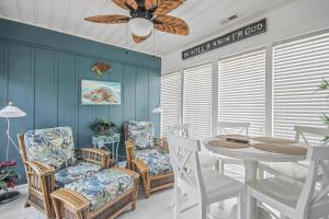 a dining room with a table and chairs at House 314 in Myrtle Beach