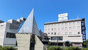 a building with a sign on the top of it at Yurihonjo - Hotel - Vacation STAY 42534v in Yurihonjo