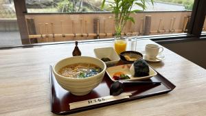 a plate of food with a bowl of noodles and sushi at Yurihonjo - Hotel - Vacation STAY 42543v in Yurihonjo