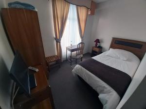 Postel nebo postele na pokoji v ubytování Hotel Esmeralda