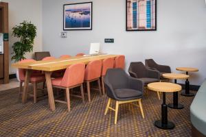 a conference room with a table and chairs at Holiday Inn Victoria - Elk Lake, an IHG Hotel in Victoria