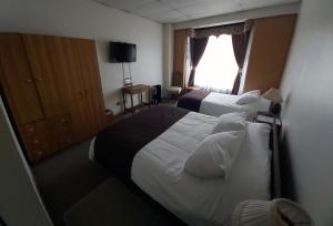 Postel nebo postele na pokoji v ubytování Hotel Esmeralda