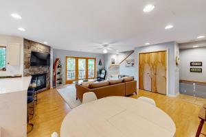 a living room with a couch and a table at Lakeview Lure in Oakland