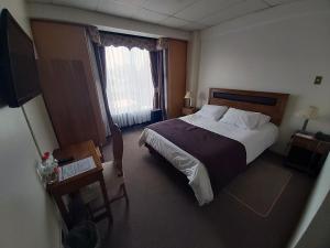 Postel nebo postele na pokoji v ubytování Hotel Esmeralda