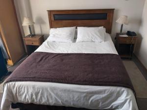 Postel nebo postele na pokoji v ubytování Hotel Esmeralda