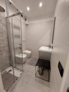 a bathroom with a shower and a sink and a toilet at G&G House in Milan