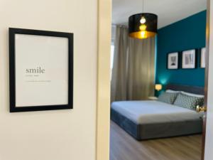 a bedroom with a bed and a picture on the wall at Le Dimore del Corso in Catania