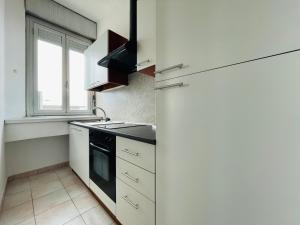 a kitchen with a refrigerator and a sink at Le Dimore del Corso in Catania