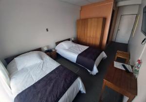Postel nebo postele na pokoji v ubytování Hotel Esmeralda