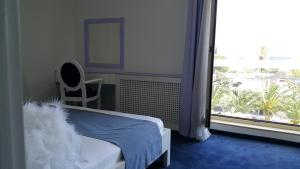 Postel nebo postele na pokoji v ubytování Apartments M Palace