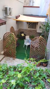 a patio with two chairs and a table and a couch at Apulia lux in Taranto