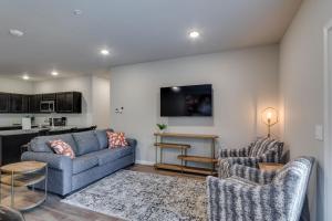a living room with a couch and two chairs at NEW 3 BR Apartment Sleeps 6 in Pigeon Forge