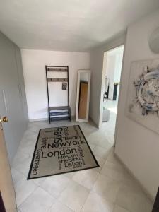 a hallway with a welcome mat on the floor at AriMAnd House in La Spezia