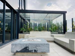 a building with a fire pit in the middle at Wynwood House 100 in Bogotá