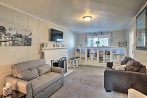 a living room with two couches and a fireplace at NEW! Unique Coeur d’Alene Cottage. 1/2 Mi to Dtwn in Coeur d'Alene