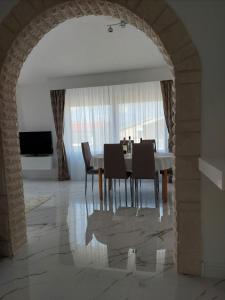 a dining room with a table and chairs at Apartment Relax in Vir