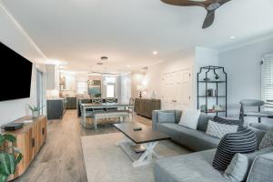 a living room with a couch and a table at Tropical Retreat in Key West