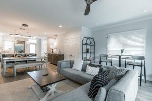 a living room with a couch and a dining room at Tropical Retreat in Key West