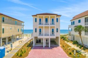 an aerial view of a building with the ocean in the background at Macon Memories in St. George Island