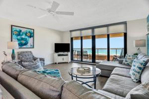 a living room with a couch and a table at Crescent Beach Club I 4G in Clearwater Beach