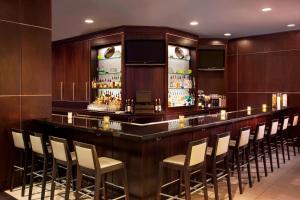 a bar in a hotel room with a bunch of chairs at The Westin Richmond in Richmond