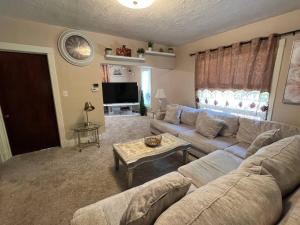 a living room with a couch and a table at Bel apartment in Sioux City