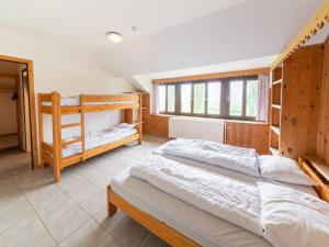 Ένα ή περισσότερα κρεβάτια σε δωμάτιο στο Villa in Ardennes with Sauna and Jacuzzi