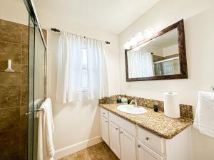 a bathroom with a sink and a shower at Charming 3BR House - Hal-UC in Los Angeles