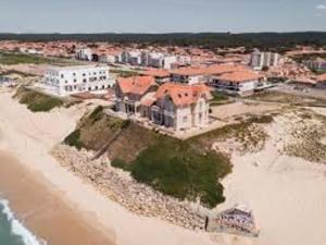 an aerial view of a house on the beach at Appartement T2 - 3 pers - à 400m de la plage, centre station, avec loggia - Biscarrosse Plage - FR-1-521-120 in Biscarrosse-Plage