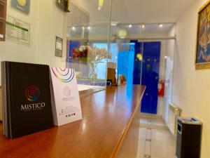 a wooden counter with a sign on top of it at Mistico San Blas Boutique in Cusco