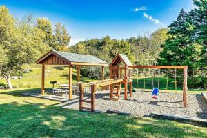 a wooden playground with a gazebo at Cabin with New Hot Tub, Near Dollywood .2BD.2BA.Sleeps6.BBQ in Sevierville