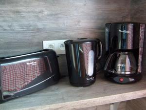 a counter with a toaster and a coffee maker on it at Chalet Crest-Voland, 6 pièces, 8 personnes - FR-1-733-2 in Crest-Voland