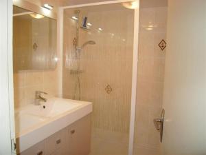 a bathroom with a sink and a shower with a shower at Appartement Crest-Voland, 2 pièces, 6 personnes - FR-1-733-6 in Crest-Voland