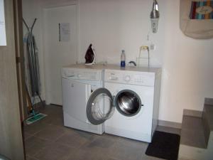 a washing machine and a washer in a room at Chalet Crest-Voland, 6 pièces, 8 personnes - FR-1-733-37 in Crest-Voland