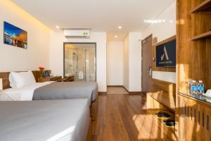 Postel nebo postele na pokoji v ubytování Avenis Hotel