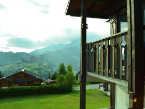 a view from a window of a house with mountains in the background at Studio Crest-Voland, 1 pièce, 4 personnes - FR-1-733-111 in Crest-Voland