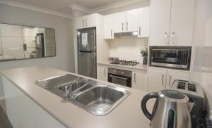 Kuchyň nebo kuchyňský kout v ubytování Cardiff Executive Apartments