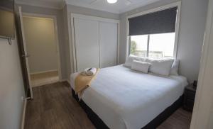 Postel nebo postele na pokoji v ubytování Cardiff Executive Apartments