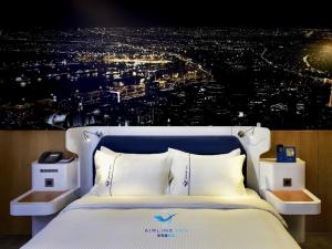 Postel nebo postele na pokoji v ubytování Airline Inn Green Park Way