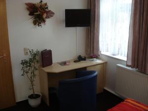 TV a/nebo společenská místnost v ubytování Hotel Bierstübl