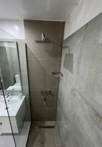 a bathroom with a shower and a sink at Buenos Aires City in Buenos Aires