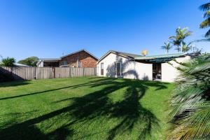 a house with a large yard with green grass at Peaceful Cul de sac in Sussex inlet