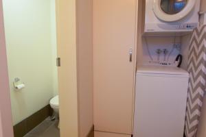 a small bathroom with a toilet and a sink at Twin Towers 102a AMS Mt Buller in Mount Buller +6 photos