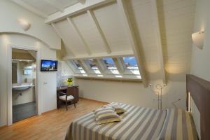Posteľ alebo postele v izbe v ubytovaní Astor Hotel