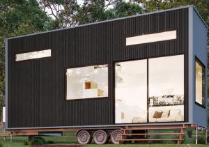 a black tiny house sitting on a trailer at BIG4 Kryal Castle Holiday Park in Leigh Creek