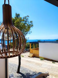 a hanging light in front of a building at Hollers Holiday Homes Haus Mary in Drage