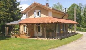 a small house with an orange roof at Garden Cottage in Rancon