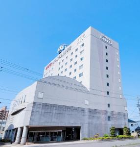 a building with a sign on top of it at Hotel KOYO Bekkan - Vacation STAY 36956v in Hashima